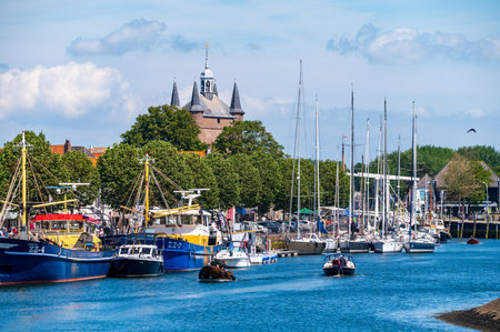 Walking in old Dutch town Zierikzee with fisherman boats, old small houses and streets, Zeeland, Netherlandsのeditorial素材