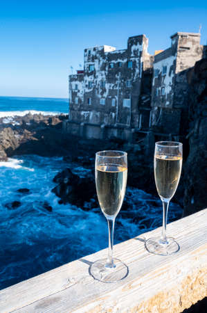 New year celebration with two glasses of champagne or Spanish cava sparkling wine and view on black...