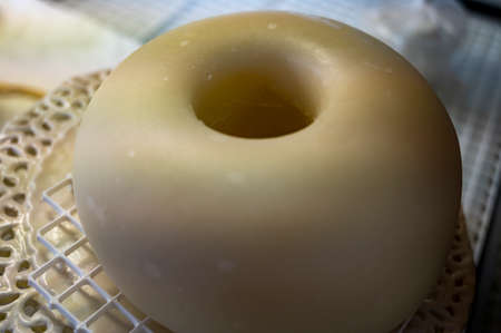 Cheese collection, provolone or Scamorza hard South Italian cow's milk cheese close up