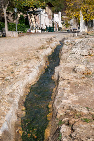 Ancient hot thermal springs and pool in nature park Dei Mulini, Bagno Vignoni, Tuscany, Italy in autumnの写真素材