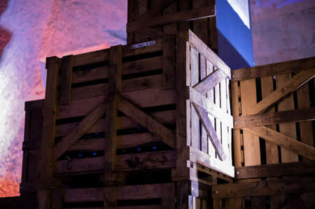 Walking in deep and long undergrounds caves with dusty bottles on racks, making champagne sparkling wine from chardonnay and pinor noir grapes in Reims, Champagne, Franceの写真素材