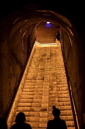 Staircase to deep and long undergrounds caves, making champagne sparkling wine from chardonnay and pinor noir grapes in Reims, Champagne, Franceのeditorial素材