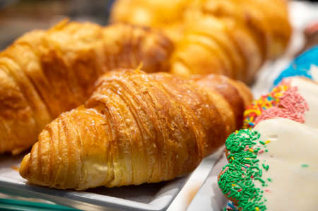 Fresh baked croissant in small French bakery for sale
