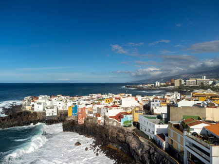 Aerial view on colorful houses and black lava rocks in small fisherman village Punta Brava near Puerto de la Cruz, Tenerife, Canary islands, Spain in winterのeditorial素材