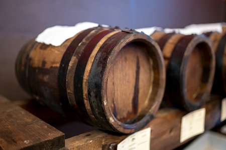 Traditional production and aging in wooden barrels of black Italian Balsamic wine IGP and DOC vinegar dressing in Modena, Italyの写真素材