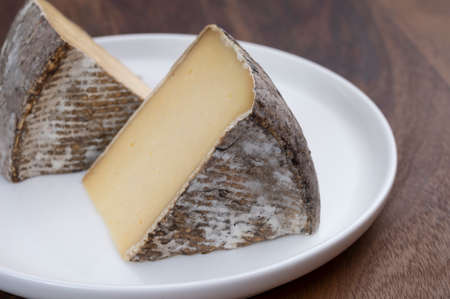 French mountain cheese from Alps, tomme de Savoie, close up