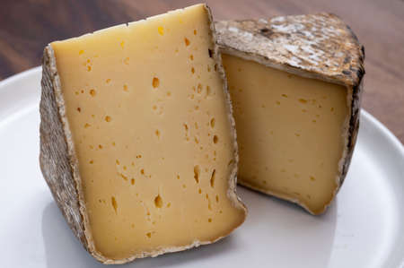 French mountain cheese from Alps, tomme de Savoie, close up
