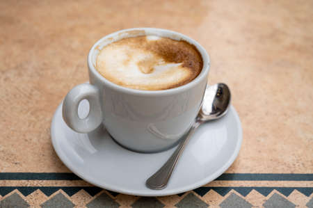 Fresh brewed coffee cappuccino in italian bar, in white cup, morning coffeeの写真素材