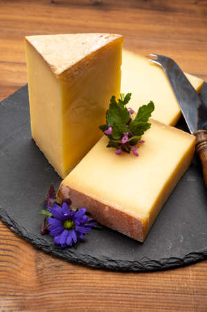 French cheese collection, comte cheese made from unpasteurized cow's milk in Franche-Comte region,...