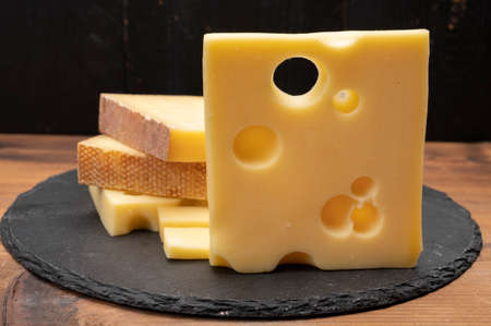 Swiss cheese collection, emmentaler with holes, gruyere, appenzeller fondue cheeses close upの写真素材