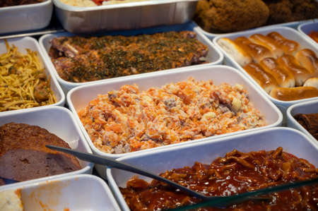 Assortment of gourmet meat dishes in butchery delicatessen shop, food backgroundの写真素材