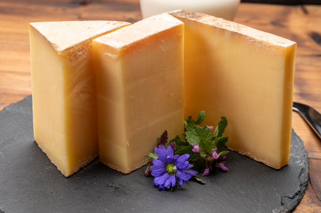 French cheese collection, comte cheese made from unpasteurized cow's milk in Franche-Comte region,...