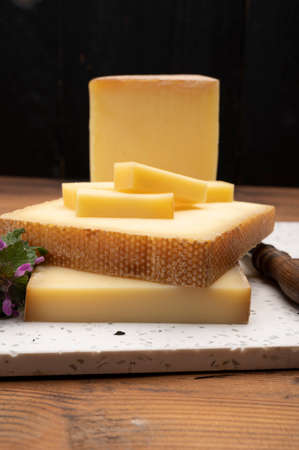 Swiss cheese collection, gruyere cheese made from unpasteurized cow's milk close upの写真素材