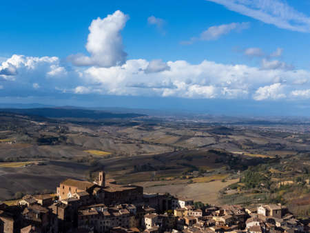 Aerial view on old town Montepulciano and hills witn vineyards, Tuscany, Italyの写真素材
