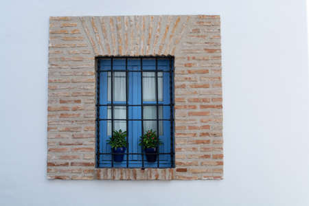 View on old part of Cordoba, San Basilio quarter with white houses and flowers pots in summer