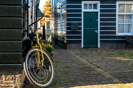 Walking on sunny spring day in small Dutch town Marken with wooden houses located on former island in North Holland, Netherlandsの写真素材