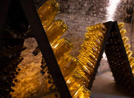 Sparkling white and rose wine production by traditional method in underground cellars in Vienna,...