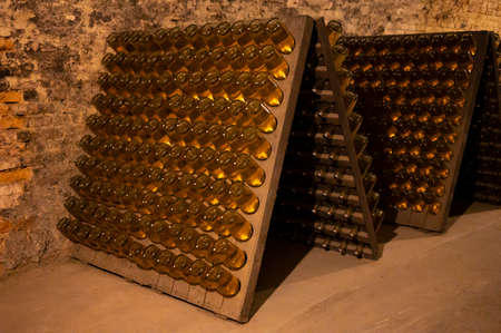 Sparkling dry white and rose wine production by traditional method in underground cellars in Vienna,...