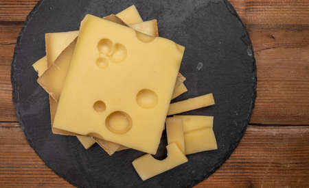Swiss cheese collection, emmentaler with holes, gruyere, appenzeller fondue cheeses close upの写真素材