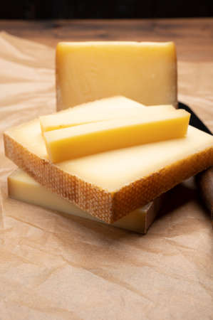 Swiss cheese collection, gruyere cheese made from unpasteurized cow's milk close up
