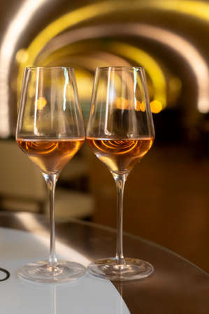 Tasting of brut champagne sparkling wine produced by traditional method in underground caves close upの写真素材