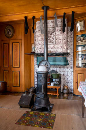 Old fashioned Dutch interior, wooden stove and room decoration in small fisherman's house in North-Holland, Enkhuizen, the Netherlandsの写真素材