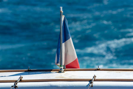 French flag, boat excursion to Calanques national park in Provence, summer vacation in Franceの写真素材