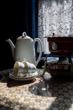 Old fashioned Dutch interior , tableware and room decoration in small fisherman's wooden houses in...