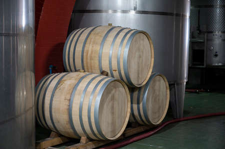 Making wine on traditional bodega in steel tanks and old wooden barrels in south part of La Palma...