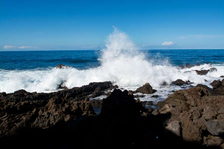 View on black lava rocks in small fisherman village Punta Brava near Puerto de la Cruz, Tenerife, Canary islandsの写真素材