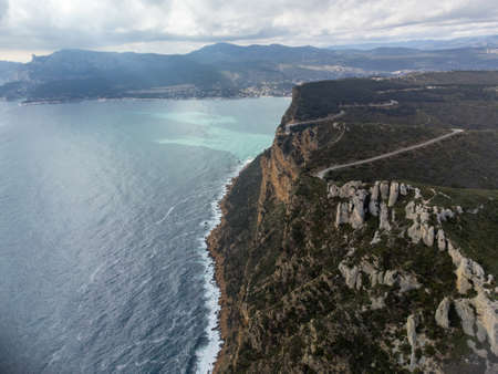Touristic route D141 road from La Ciotat to Cassis, panoramic aerial view on blue sea, limestone's cliffs and green pine forest, vacation in Provence, Franceの写真素材
