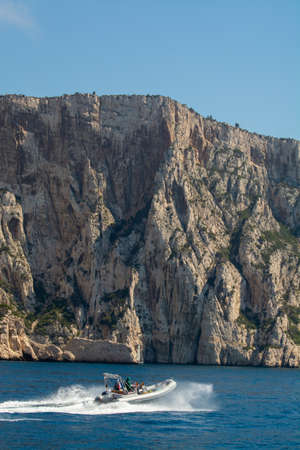 Limestone cliffs and blue sea near Cassis, boat excursion to Calanques national park in Provence,...