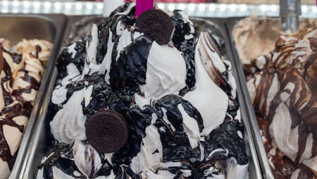 Assortment of colorful artisanal ice creams in refrigerator close up in Spain