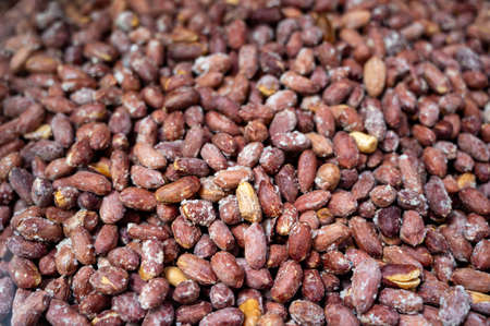 Roasted sugary peanuts, tasty healthy vegetarian food backgroundの写真素材