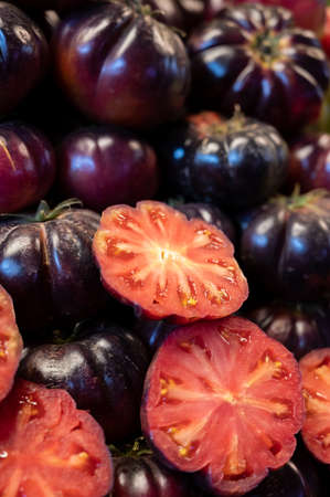 Ripe tasty organic tomatoes for sale on farmers market in Malaga, Andalusia, Spain, close upの写真素材