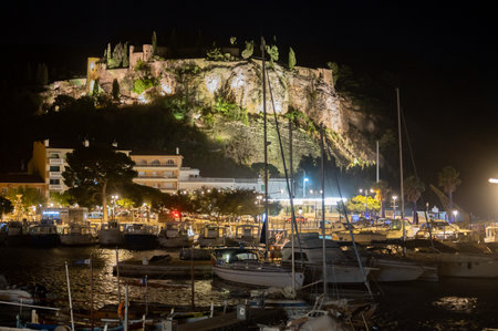 Night in South of France, view on old fisherman's port with boats and lighted buildings in Cassis,...