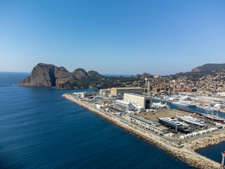 Panoramic aerial view on old historical coastal Provencal city La Ciotat with large sailboat harbor and yacht shipyard, summer vacation in Provence, Franceのeditorial素材