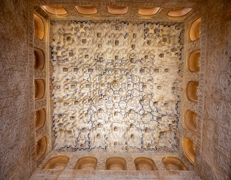 Ornamental ceiling and walls in Nasrid Palaces in the Alhambra palace Granada, Andalusia, Spain, architectural detailsのeditorial素材