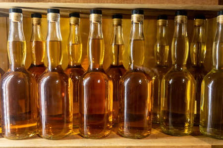 Different ages and colors of strong alcoholic apple drink calvados in Normandy, Calvados region, France, calvados tasting tourの写真素材