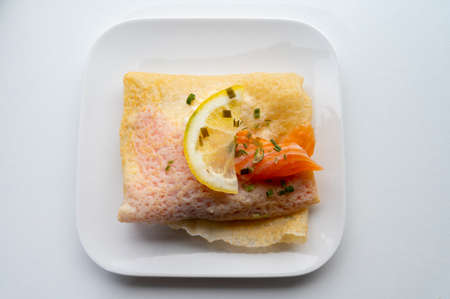 Cuisine of Normandy, galette pancake filled with goat cheese and smoked salmon served with fresh lemon, Franceの写真素材