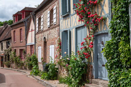 Tourist destination, one of most beautiful french villages, Gerberoy - small historical village with half-timbered houses and colorful roses flowers, Franceの写真素材