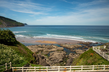 Atlantic ocean bay with sanly beach in Bakio, small touristic village near Bilbao, Basque Country, Spainの写真素材
