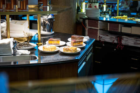 Austrian desserts, different types of chocolate and fruit cakes on display in cafe in Vienna.