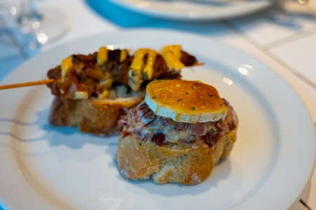Assortment of typical snacks of Basque Country and Navarre, pinchos or pinxtos, small piece of bread...