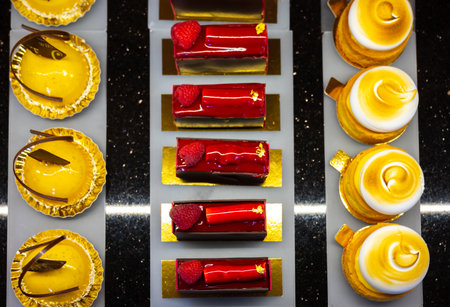 Austrian desserts, different types of chocolate and fruit cakes on display in cafe in Vienna.の写真素材