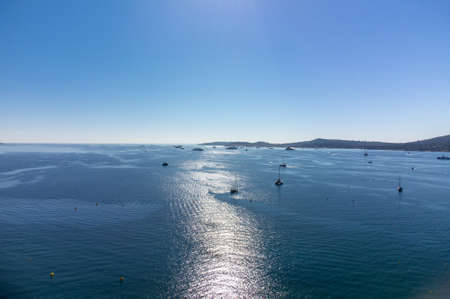 Aerial view on blue water of Gulf of Saint-Tropez, sail boats, houses of Port Grimaud and Port Cogolin, summer vacation in Provence, Franceの写真素材