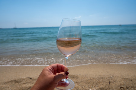 Cold rose wine from Provence served outdoor on white sandy beach Plage de Pampelonne near...