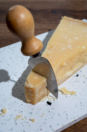 Italian cheese collection, piece of old matured grana padana cheese made from cow milk in Italy, close upの写真素材
