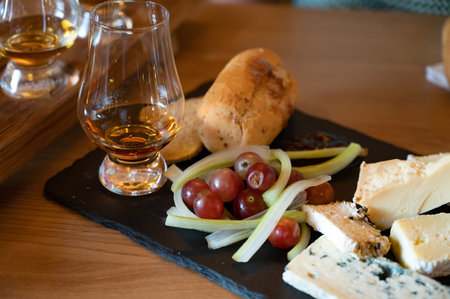 Pairing of scotch whiskeys and farmers scottish cheeses cheddar, stilton, blue cheese, brie, tasting...