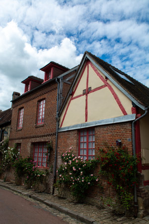 Tourist destination, one of most beautiful french villages, Gerberoy - small historical village with half-timbered houses and colorful roses flowers, Franceのeditorial素材